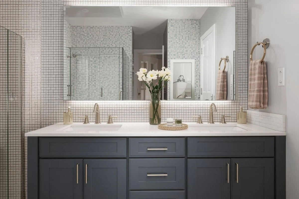Mirrors and Lighting That Make Vanities Feel Bigger